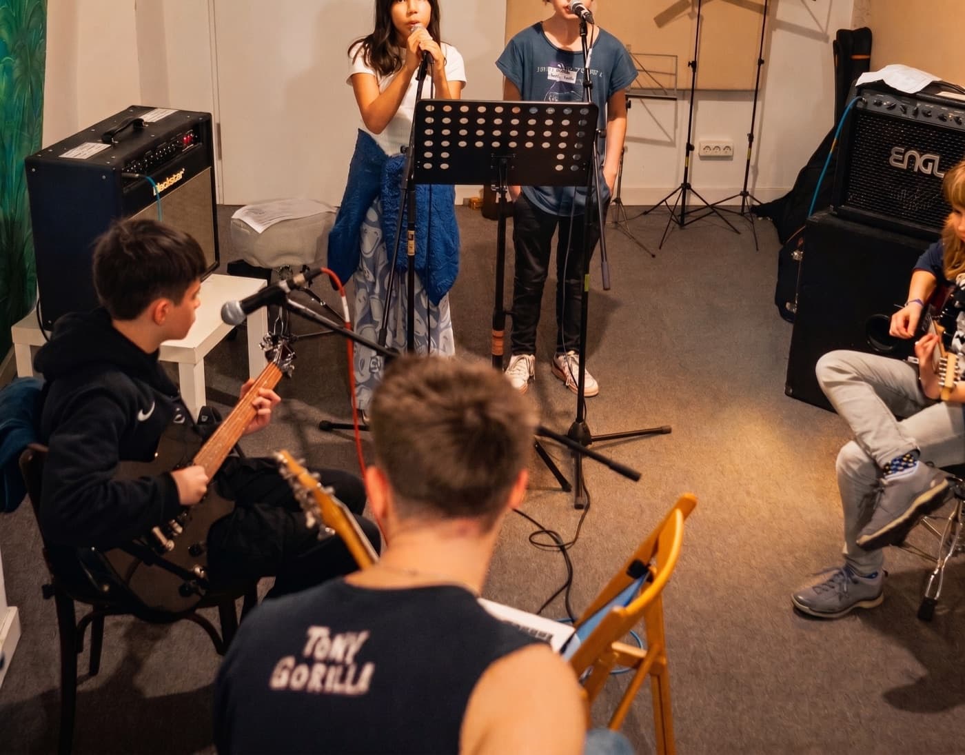 Kids band jam in the rehearsal room